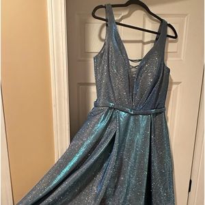 A sparkly dark blue David’s Bridal Dress. Size 14 with tags still on